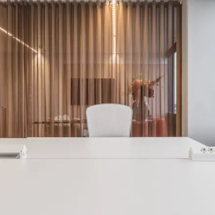 Stylish office space at Piet Heinkade 55, Amsterdam Center with a modern workspace setup and floor-to-ceiling windows, available for office space rental.