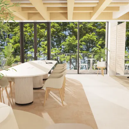 Bright and modern office space in Amsterdam Center with large windows, elegant furniture, and lush greenery views, ideal for rent office space or office space rental opportunities.