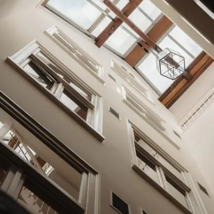 Upward view of the interior architecture at Prins Hendrikkade 14, perfect for office space rental in Amsterdam Center.