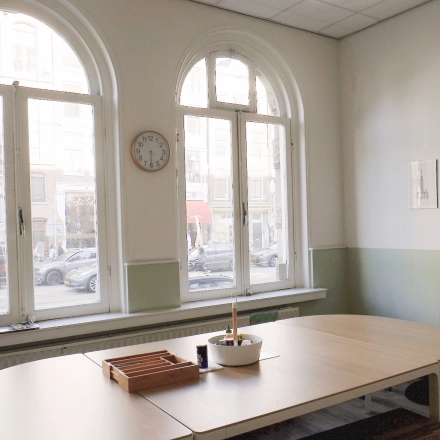 Bright office space at Raadhuisstraat 15, Amsterdam Center, suitable for rent office space, with large windows and a minimalistic design.