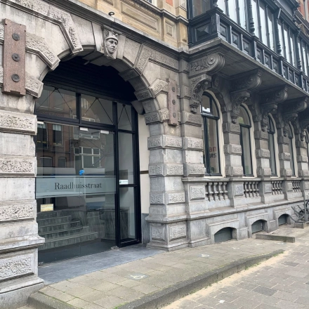Exterior view of office space for rent at Raadhuisstraat 15, Amsterdam Center, showcasing a historic stone facade.
