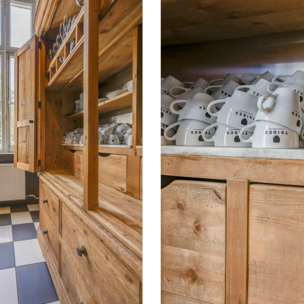 Bright interior with wooden cabinets and abundant mugs at a rental office space in Amsterdam Center's Raamplein 1.