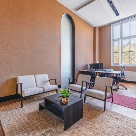 Cozy office space with natural light, ideal for office space rental at Raamplein 1, Amsterdam Center.