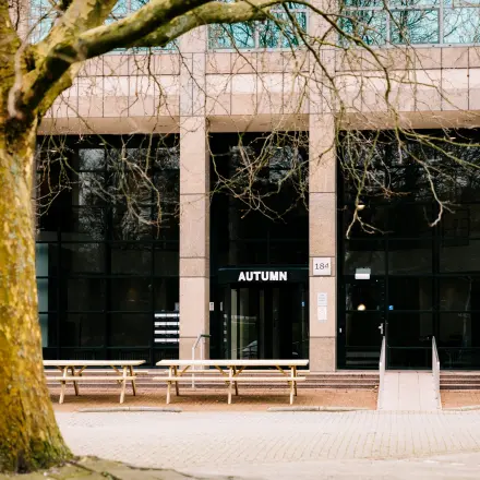 Exterior view of Overschiestraat 182, an office to rent in Amsterdam De Schinkel. The building features large windows and a welcoming entrance.