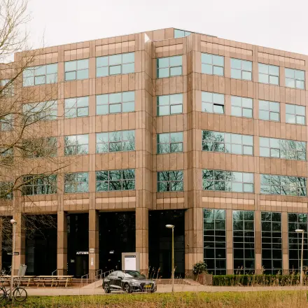 Exterior view of office building at Overschiestraat 182, Amsterdam De Schinkel, showcasing large windows and modern design, ideal for office space rental.