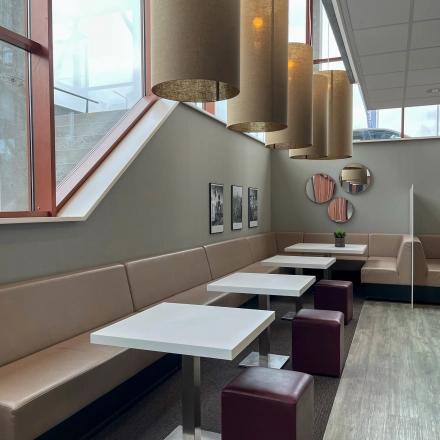 Bright office space rental at Daalwijkdreef 47, Amsterdam Duivendrecht with contemporary seating and ample lighting, ideal for dynamic workspaces.