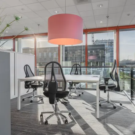 Bright office to rent in Amsterdam Duivendrecht with modern furniture and large windows offering a city view.