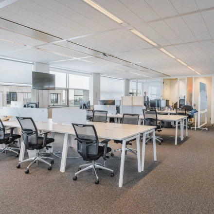 Bright and spacious office at Piet Heinkade 95B, Amsterdam East, featuring multiple workstations perfect for rent office space.