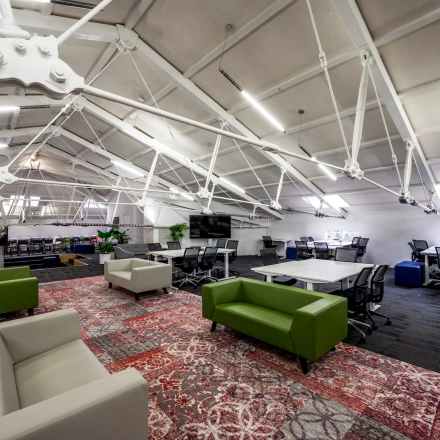 Spacious office to rent on Sarphatistraat 370, Amsterdam East, featuring modern furniture and open workspaces ideal for office space rental.
