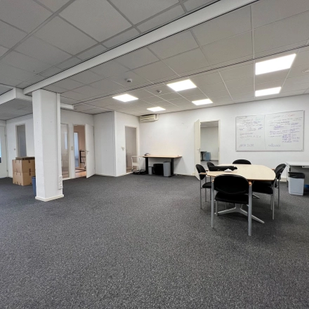Spacious office interior at Contactweg 131, Amsterdam Sloterdijk, suitable for office space rental with seating and work tables.