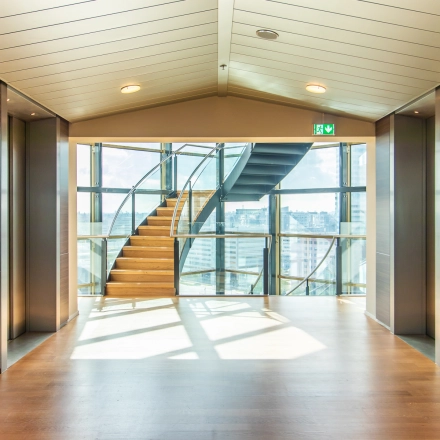 Bright foyer area with a staircase and an expansive view, located at Radarweg 29, Amsterdam Sloterdijk, ideal for office space rental.