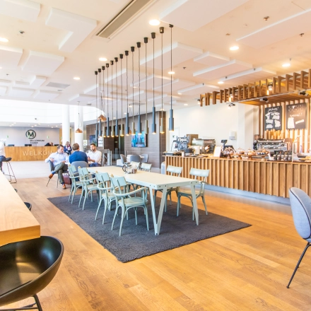 Bright workspace at Radarweg 29, Amsterdam Sloterdijk, featuring a modern interior with communal seating, ideal for those seeking office space rental.