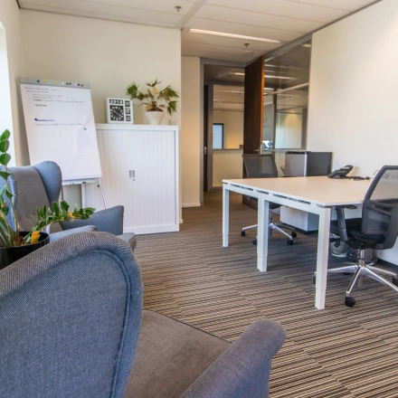Interior office space at Radarweg 29, Amsterdam Sloterdijk, featuring modern furnishings with desks, chairs, and plants, ideal for office space rental.