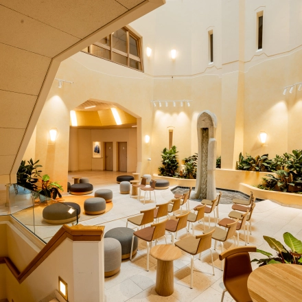 Spacious office interior at Bijlmerplein 888, Amsterdam South East, featuring modern seating arrangements and vibrant natural light, perfect for office space rental.