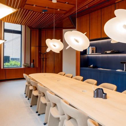 Modern office to rent at Bijlmerplein 888, Amsterdam South East, featuring a stylish conference room with elegant lighting and contemporary furnishings.