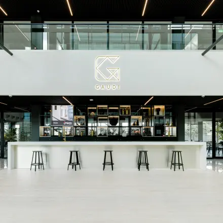 Spacious and modern interior with seating options at a bar-style counter, perfect for office space rental at Herikerbergweg 288, Amsterdam South East.