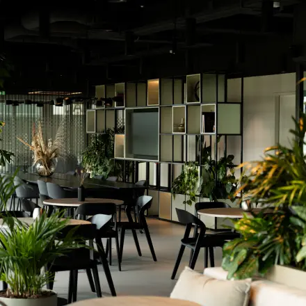 Modern office space located on Herikerbergweg 290 in Amsterdam South East, featuring lush greenery and contemporary furnishings available for office space rental.