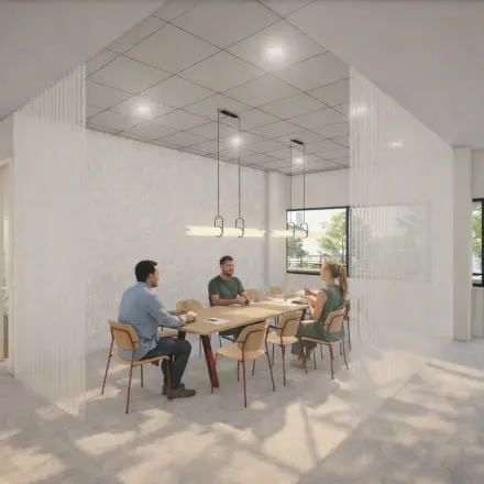 Modern office space at Luttenbergweg 8, Amsterdam South East with four people collaborating around a conference table, available for rent.