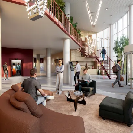 Interior view at Luttenbergweg 8, Amsterdam South East, showcasing a modern, furnished office space rental with people engaging in business activities like meetings and discussions.