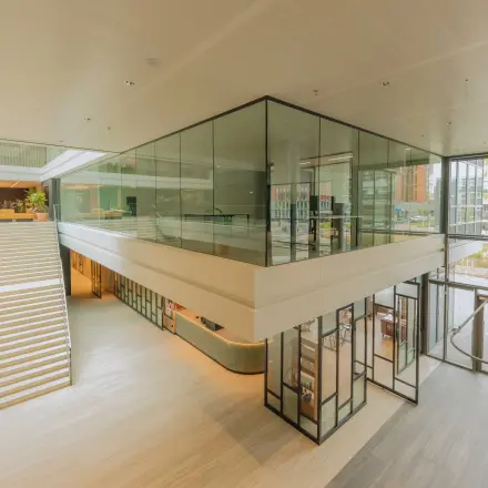 Spacious interior view of an office space at Kon. Wilhelminaplein 4, Amsterdam West, showcasing modern architecture and natural light. Ideal for office space rental.
