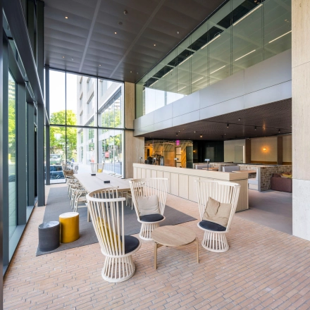 Spacious office to rent in Amsterdam West with modern furnishings, featuring high ceilings and large windows at Nachtwachtlaan 20. Ideal for anyone seeking office space rental with ample natural light.