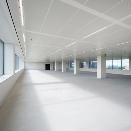 Spacious unfurnished office space with large windows at Nachtwachtlaan 20, Amsterdam West, available for rent.
