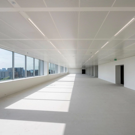 Spacious, unfurnished office to rent at Nachtwachtlaan 20, Amsterdam West, with large windows and an open floor plan ideal for office space rental.