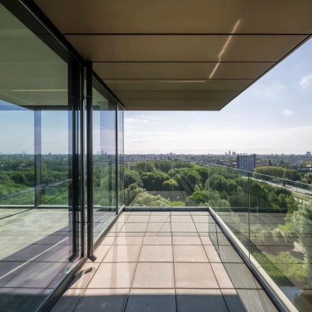 Spacious office balcony at Nachtwachtlaan 20, Amsterdam West, with expansive city views ideal for office space rental.