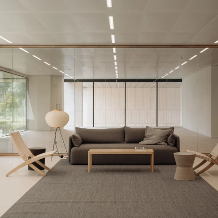 Modern office to rent featuring a cozy seating area with a sofa and chairs, ideal for meetings. Located in Amsterdam West, offering excellent office space rental opportunities.