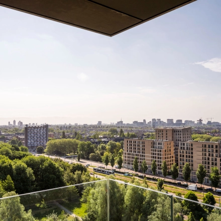 View from an office to rent at Nachtwachtlaan 20, overlooking the city and green areas in Amsterdam West.