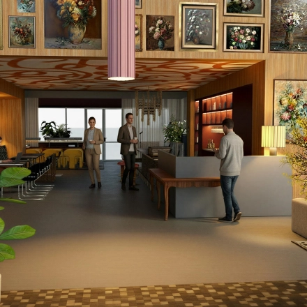Stylish office space with art-adorned walls, where people are engaged in conversation and work activities. Ideal office space rental in Amsterdam Zuidas.