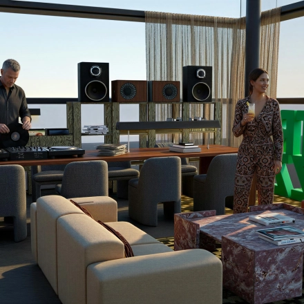 Stylish office space for rent at Barbara Strozzilaan 101 101, Amsterdam Zuidas. Features a modern lounge with DJ playing music, and two people conversing, enhancing this office space rental.