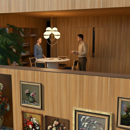 Two individuals have a meeting at a round table in a tastefully decorated office with wood paneling at Barbara Strozzilaan 101 101, Amsterdam Zuidas. Ideal for rent office space seekers.