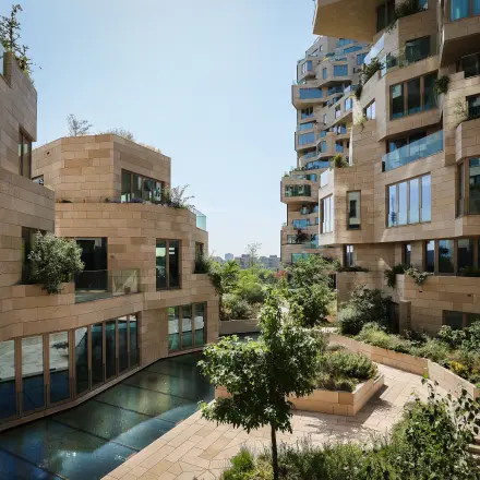 Exterior view of the office building at Beethovenstraat 503, Amsterdam Zuidas, featuring modern architecture and garden areas, ideal for those seeking office space rental.