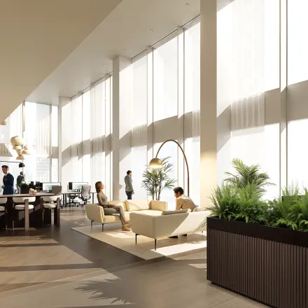 Modern office space at Claude Debussylaan 80-134, Amsterdam Zuidas, featuring natural light, stylish furniture, and professionals collaborating. Ideal for office space rental.