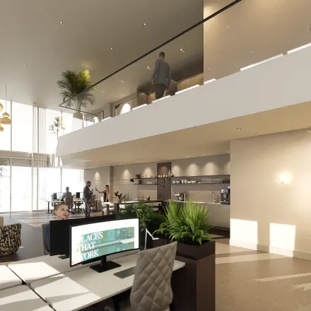 Modern office space for rent at Claude Debussylaan 80-134, Amsterdam Zuidas, featuring stylish workstations and a lounge area. People are engaging in collaborative work activities.