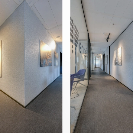 Hallway of office space at Gustav Mahlerplein 28 & 58-60, Amsterdam Zuidas, featuring modern art on the walls.