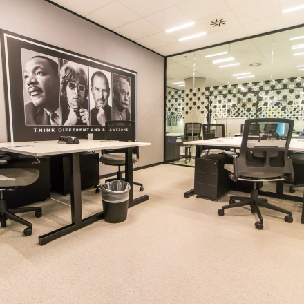 Spacious and modern office to rent in Amsterdam Zuidas at Gustav Mahlerplein. Features contemporary furnishings and a unique wall design, ideal for team collaborations or meetings.