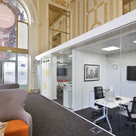 Modern office space with glass partitions and contemporary furnishings at Pelikaanstraat 3, Antwerp Center, ideal for rent office space.