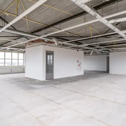 Spacious office area available for rent at Het Rietveld 55-59 in Apeldoorn, perfect for customizing your office space rental needs with ample natural light.