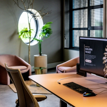 Modern furnished office space with a desk, computer, stylish chairs, and decor at Lange Amerikaweg 55-61, Apeldoorn, available for rent.