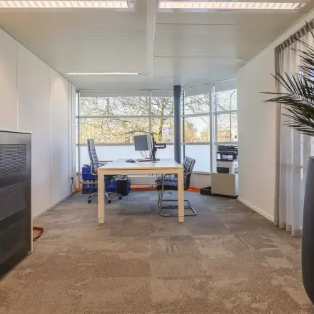 Bright office space for rent at Prins Willem-Alexanderlaan 301, Apeldoorn, featuring modern furnishings and ample natural light.