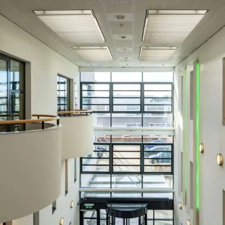 Interior view of Schumanpark 9 in Apeldoorn showcasing natural light filling the office space available for rent.