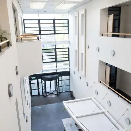 Bright interior of an office space at Schumanpark 9, Apeldoorn, highlighting ample natural light and modern design. Perfect for those seeking office space rental.