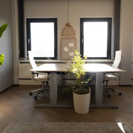 Bright office space in Schumanpark 9, Apeldoorn, featuring modern furnishings and large windows for ample natural light. Ideal for office space rental.