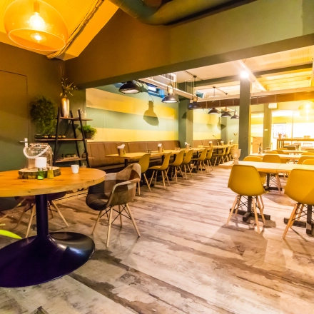 Modern office space at Jansbuitensingel 7, Arnhem Centrum with stylish furniture and ambient lighting, available for rent. Ideal for meetings or as a workspace rental option.