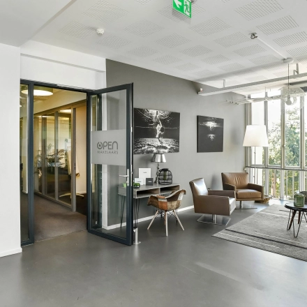 Bright office space with large windows and modern furnishings at Jansbuitensingel 7, perfect for rent office space in Arnhem Centrum.