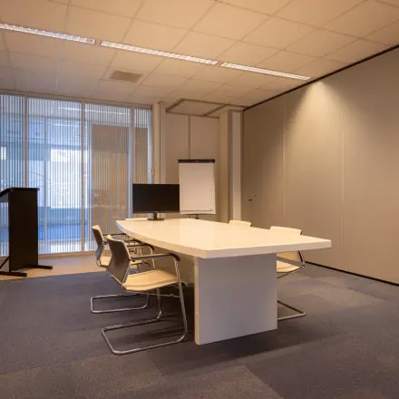 Furnished office space with a meeting table and chairs at Amalialaan 126, ideal for office space rental.
