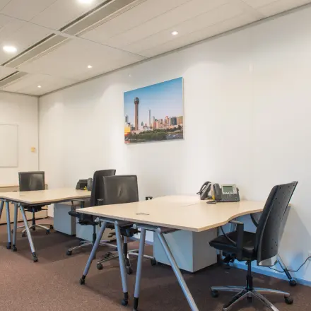 Furnished office space with desks and chairs for rent at Carrer de la Marina 16-18, Barcelona Sant Martí, ideal for business activities.