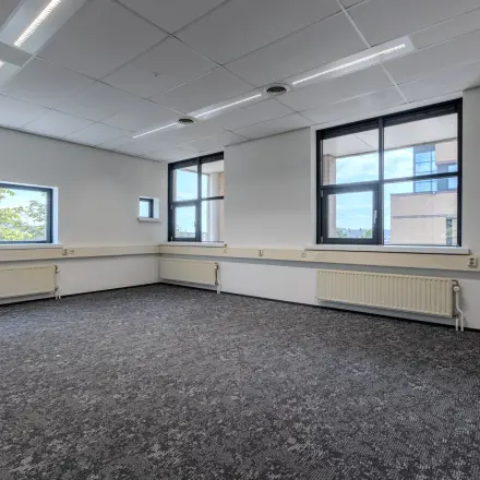 Bright office space at Rijtuigweg 10, Bergen op Zoom, perfect for office space rental with large windows letting in natural light.